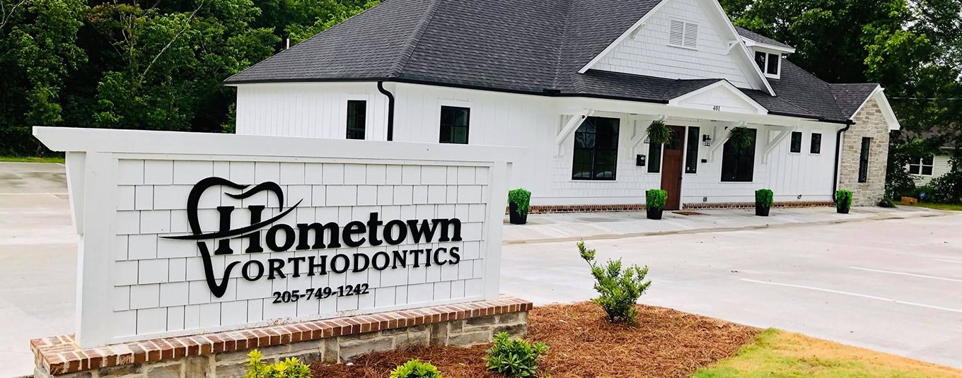 Hometown Orthodontics office building and sign at the Oneonta, AL location